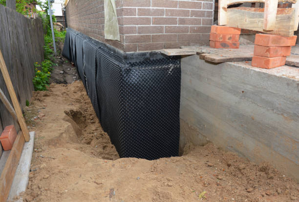 SJ Waterproofing Pros technician performing targeted Waterproofing assessment in Watson, AL